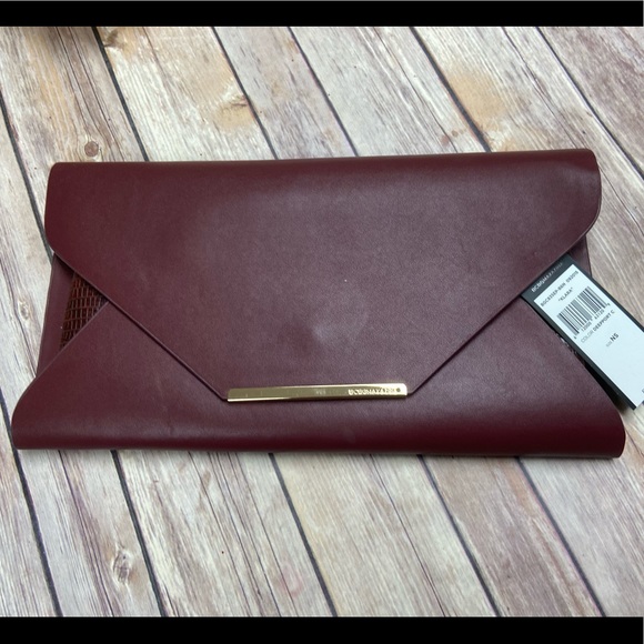 BCBGMaxAzria Handbags - BCBGMAXAZRIA Burgundy Clutch NWT